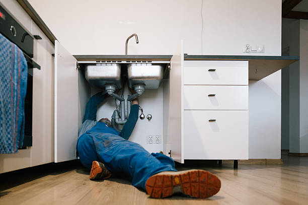 Professional Emergency Plumber technician working in Lisbon, ND